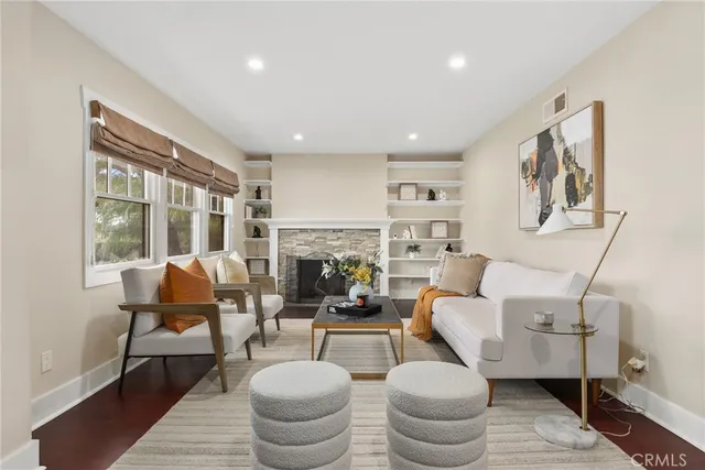 a living room with furniture or couch and a fireplace