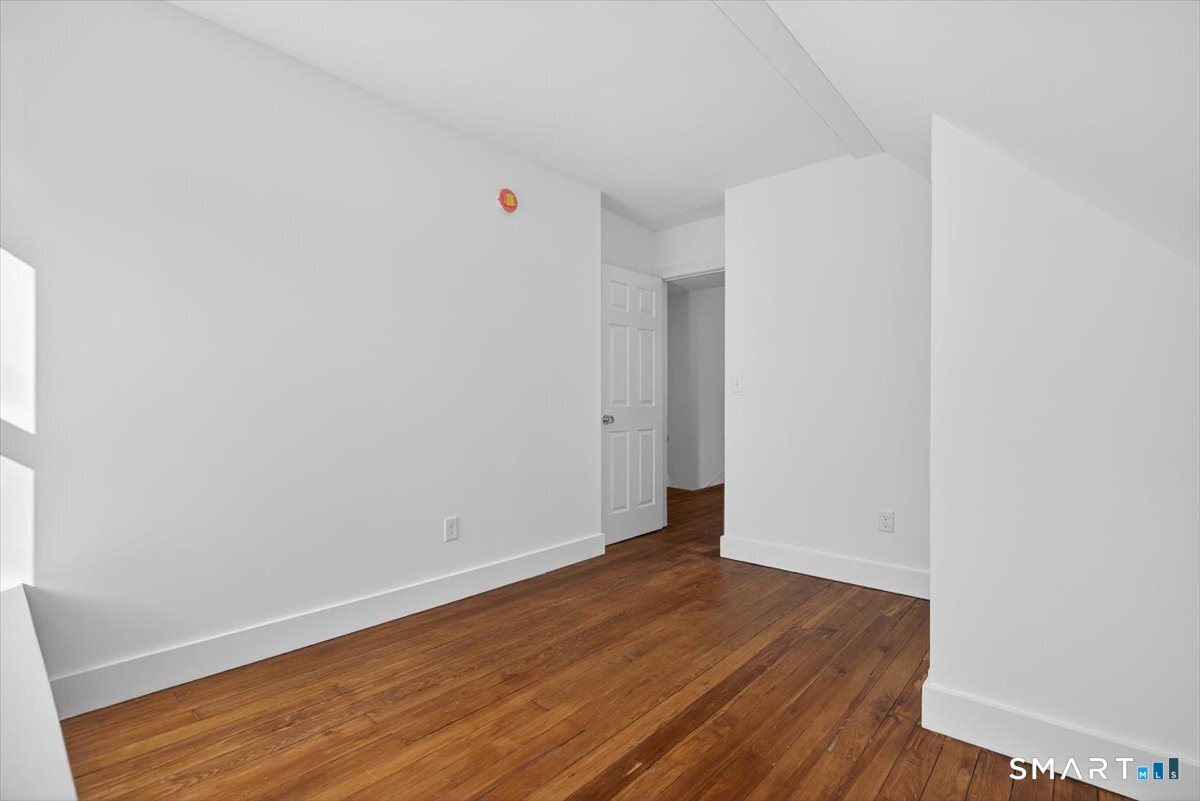 62 General Street Stratford, CT 06615 - Photo 13 of 40 a view of an empty room with wooden floor