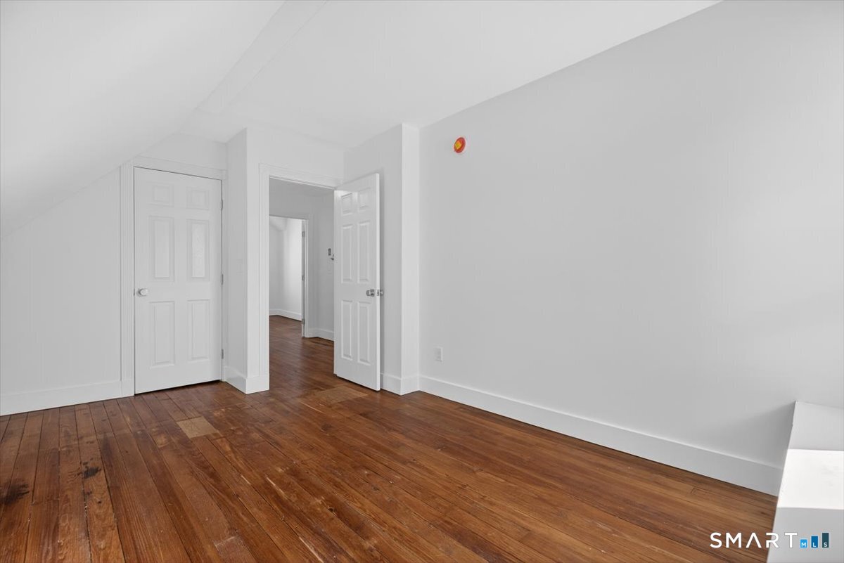 62 General Street Stratford, CT 06615 - Photo 14 of 40 a view of an empty room with wooden floor