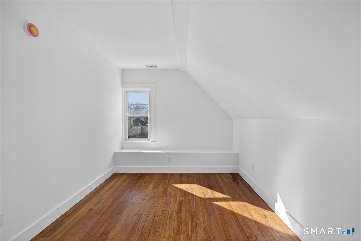 62 General Street Stratford, CT 06615 - Photo 15 of 40 a view of room with window and wooden floor