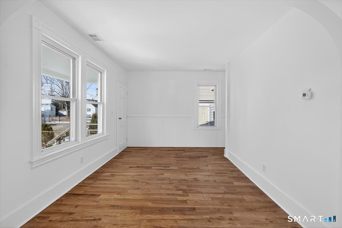 62 General Street Stratford, CT 06615 - Photo 20 of 40 a view of an empty room with wooden floor and a window