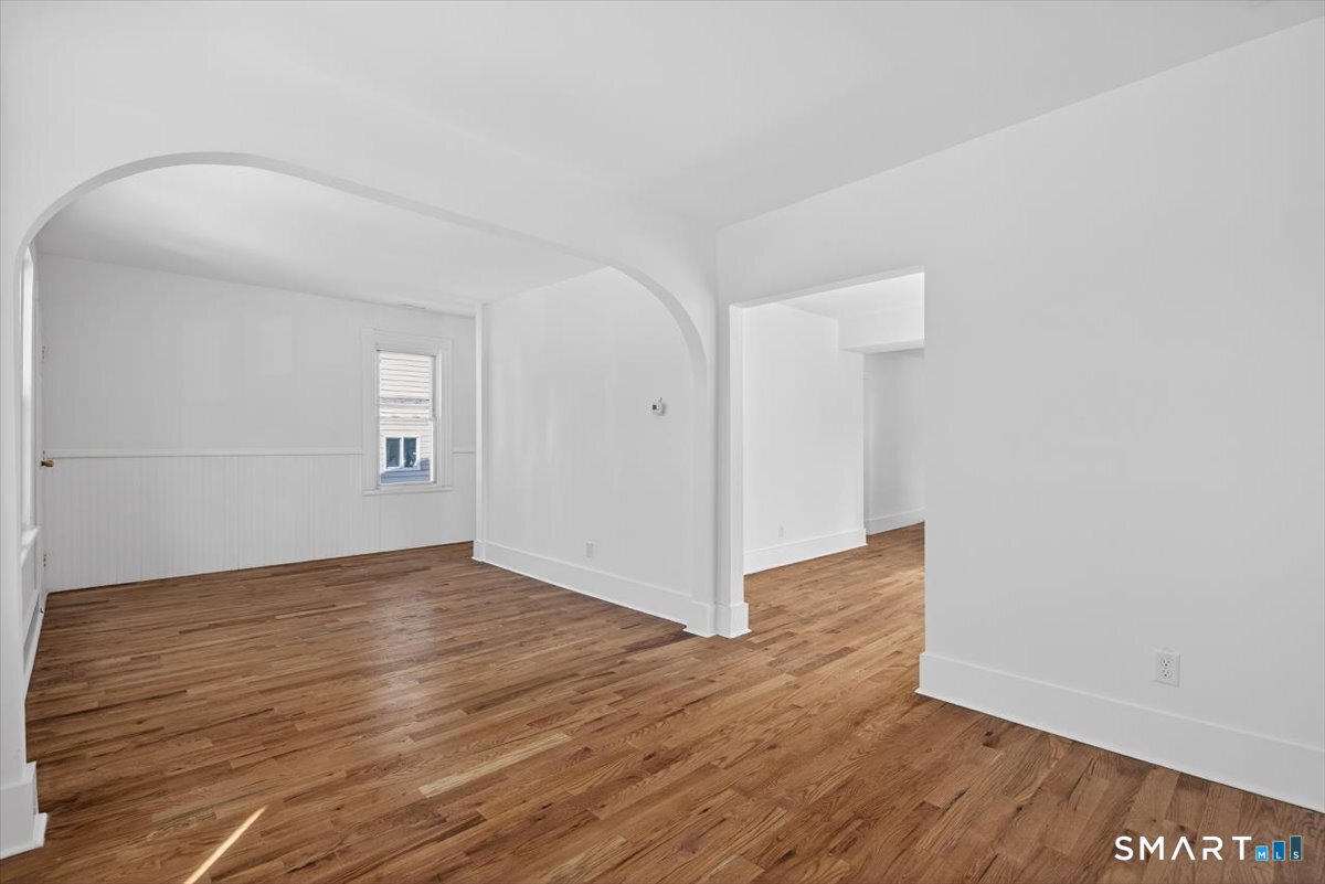 62 General Street Stratford, CT 06615 - Photo 21 of 40 a view of wooden floor and windows in a room