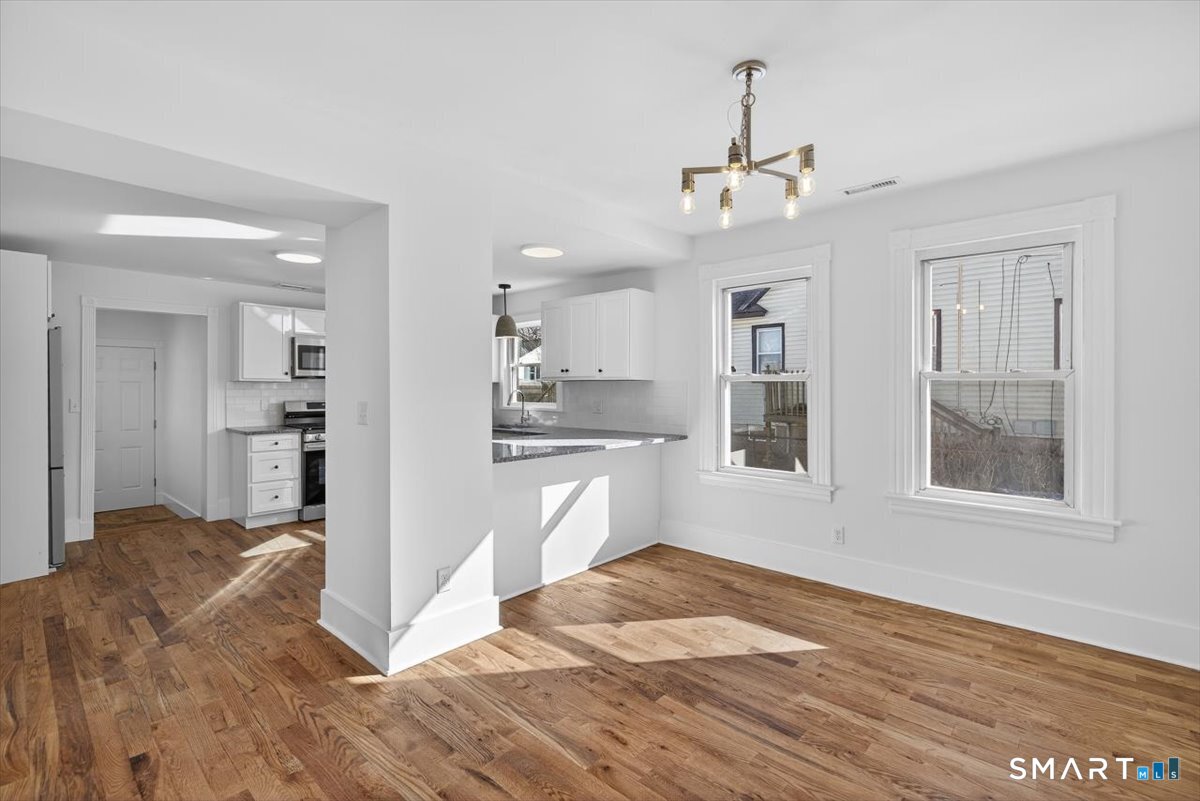62 General Street Stratford, CT 06615 - Photo 22 of 40 a view of a kitchen with wooden floor and a kitchen