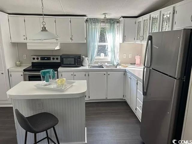 600 Ermine Road, Unit LOT 620 West Columbia, SC 29170 - Photo 5 of 11 Kitchen featuring appliances with stainless steel finishes, light countertops, white cabinets, and a center island