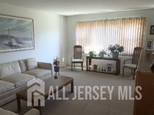 178 Willow Street Port Reading, NJ 07064 - Photo 4 of 15 a living room with furniture and a large window