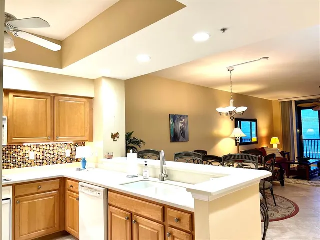 a bedroom with a bed and ceiling fan