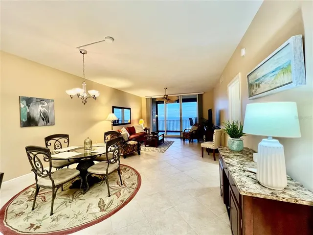 a bedroom with a large bed and flat tv screen