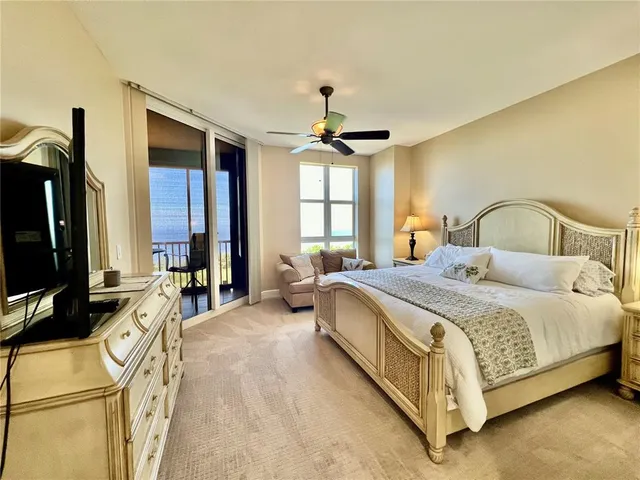 a bathroom with a tub double sink and mirror