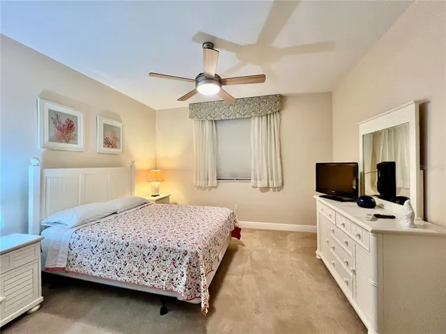 a view of backyard with plants and outdoor seating