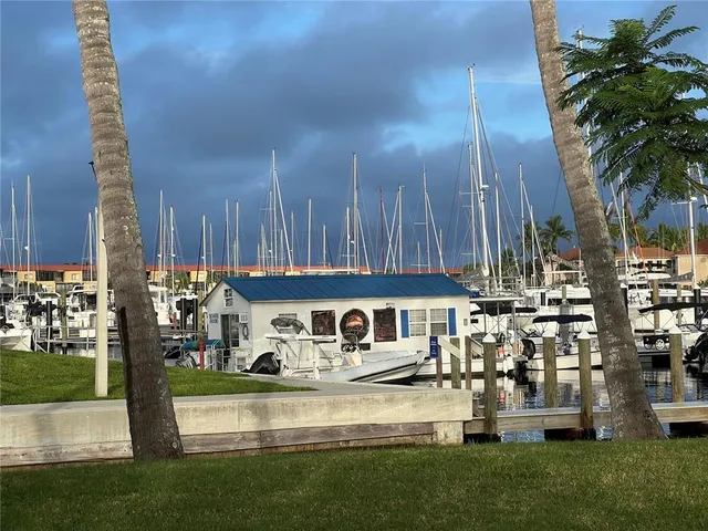 a room with lots of chairs and a large window