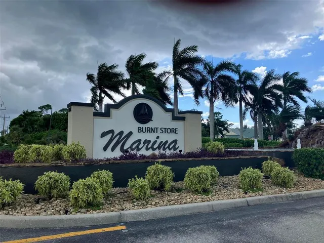 a front view of house with yard and swimming pool