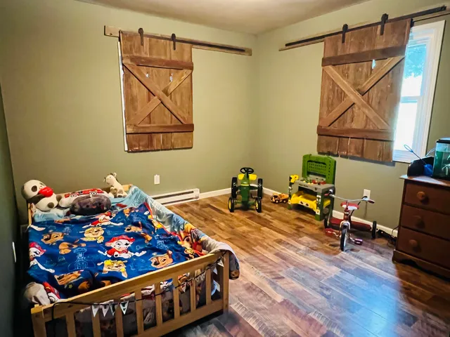 a room with toys and wooden floor