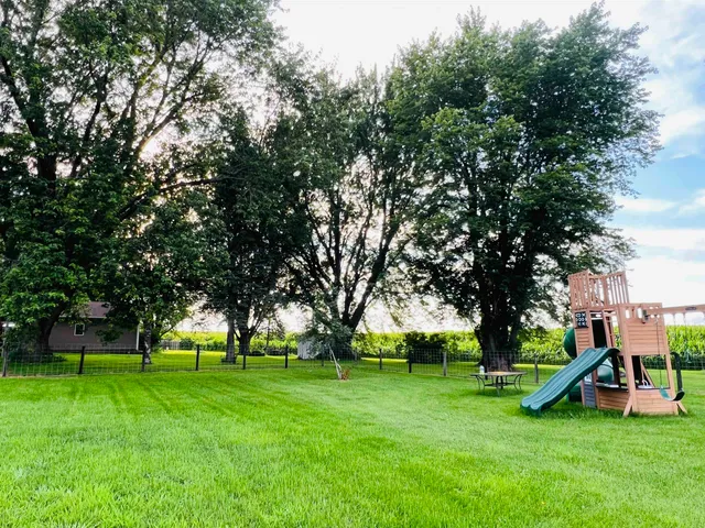a view of a park with large trees