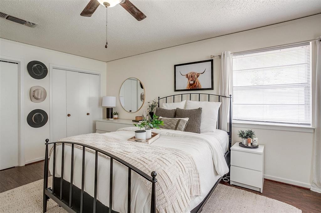 3217 Lubbock Avenue Fort Worth, TX 76109 - Photo 19 of 38 a bedroom with a bed and a window