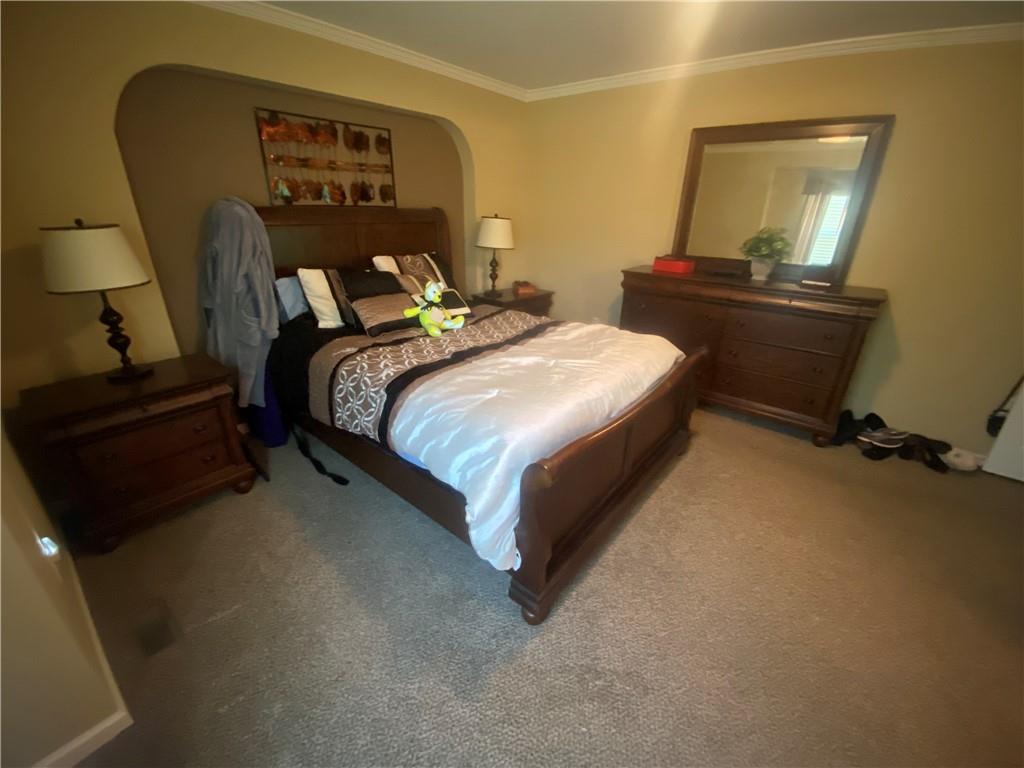 232 Center School Road Jefferson, PA 15344 - Photo 11 of 22 a bedroom with a bed and wooden floor