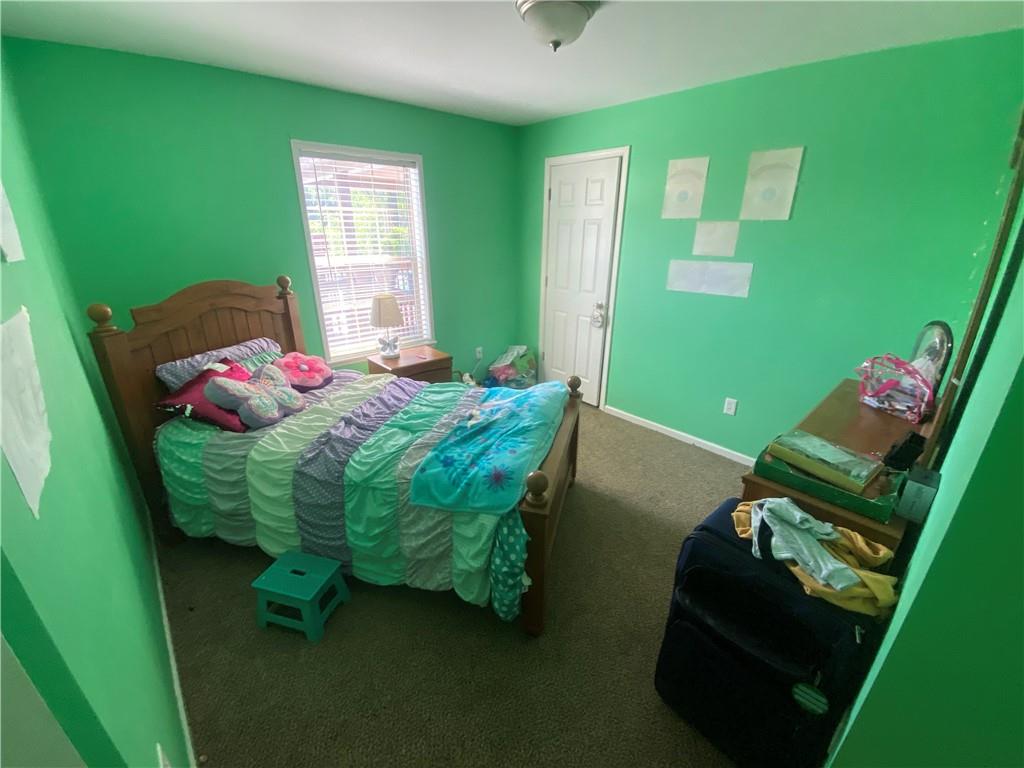 232 Center School Road Jefferson, PA 15344 - Photo 15 of 22 a bedroom with a bed and windows
