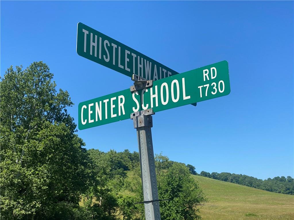 232 Center School Road Jefferson, PA 15344 - Photo 22 of 22 a street sign on a pole on a street