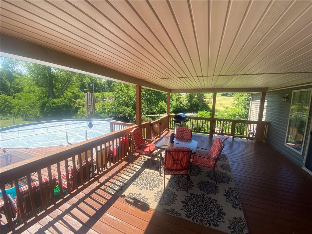 232 Center School Road Jefferson, PA 15344 - Photo 4 of 22 a view of a chairs and table in patio with wooden floor