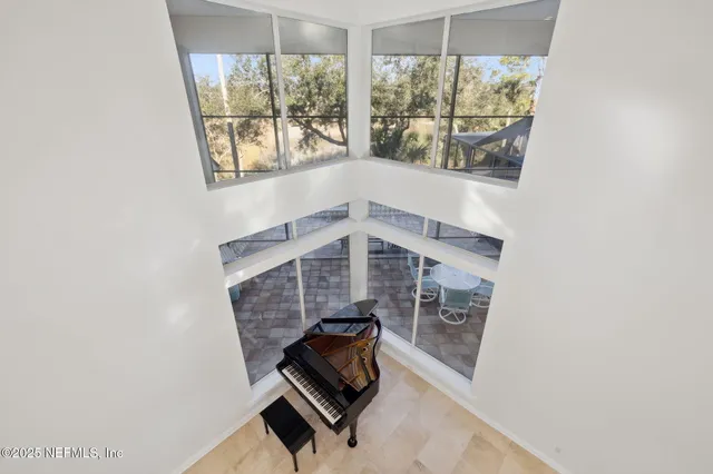a view of a living room and kitchen with a large window