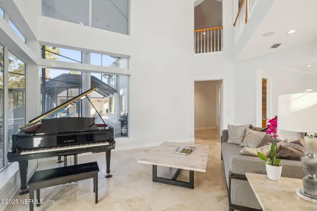 a kitchen with stainless steel appliances granite countertop a refrigerator and a stove