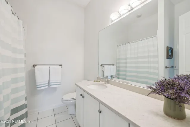 an aerial view of a houses with a city