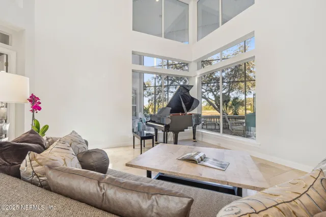 a view of a dining room and livingroom with furniture and wooden floor