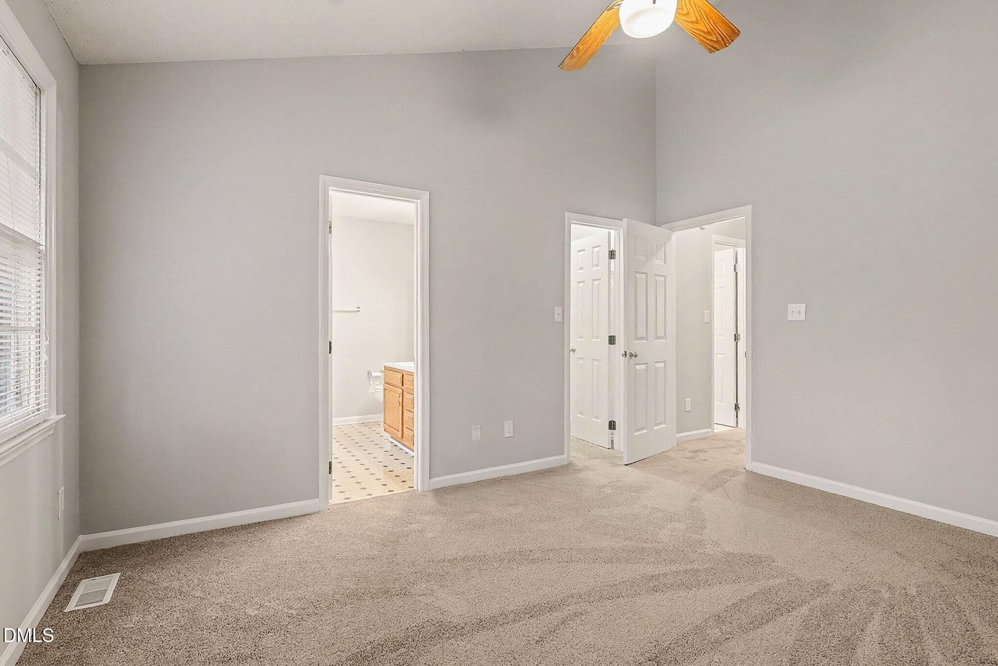 7 Neptune Court Durham, NC 27712 - Photo 18 of 39 an empty room with windows and closet