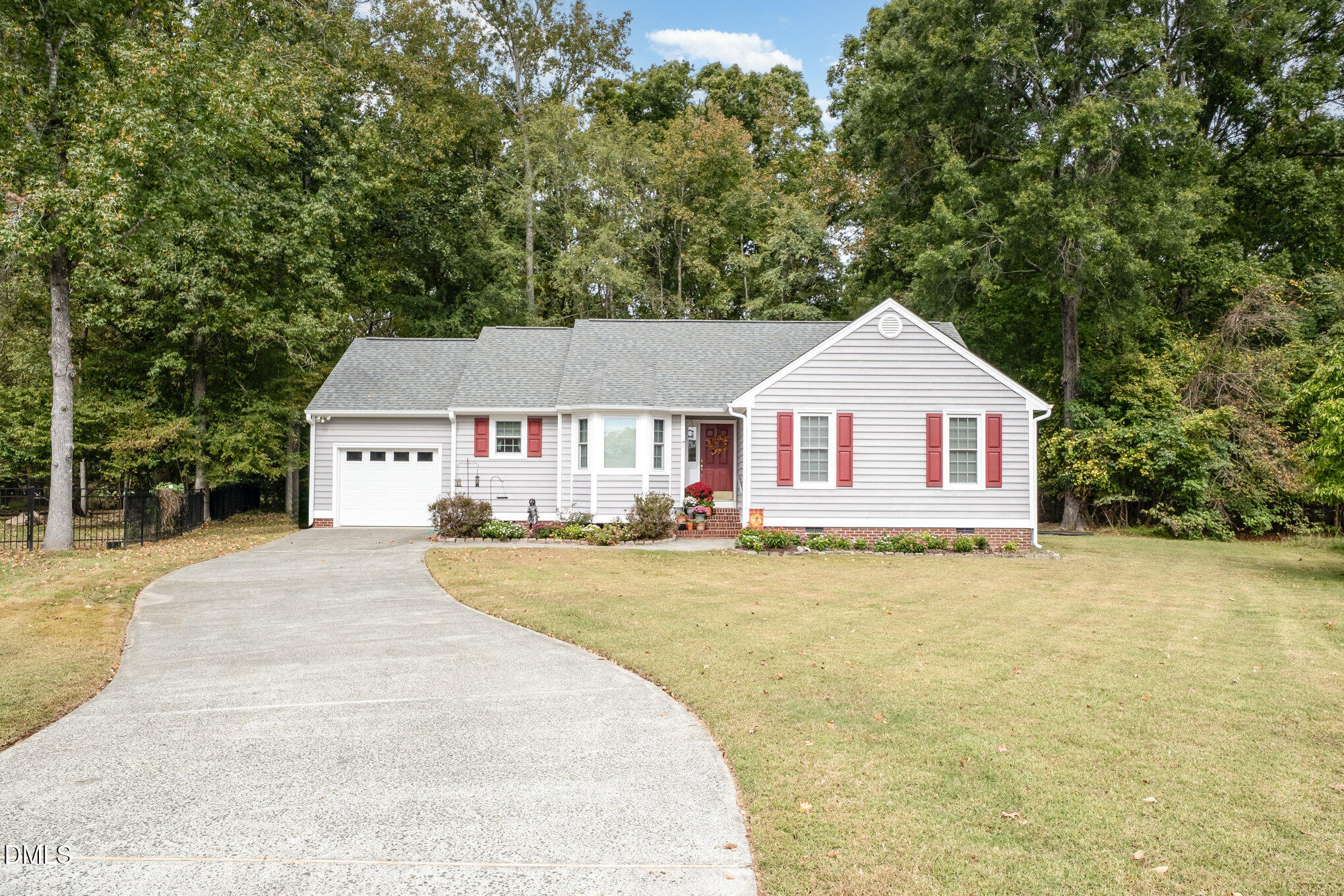 7 Neptune Court Durham, NC 27712 - Photo 2 of 39 a front view of a house with a yard and garage