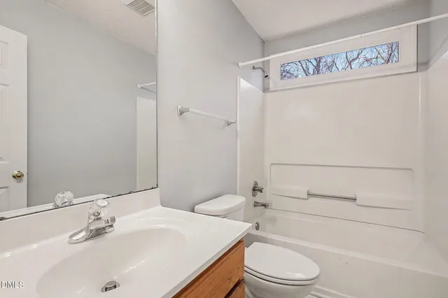 a view of staircase with white walls