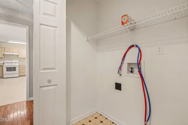 a view of balcony with wooden floor and outdoor seating