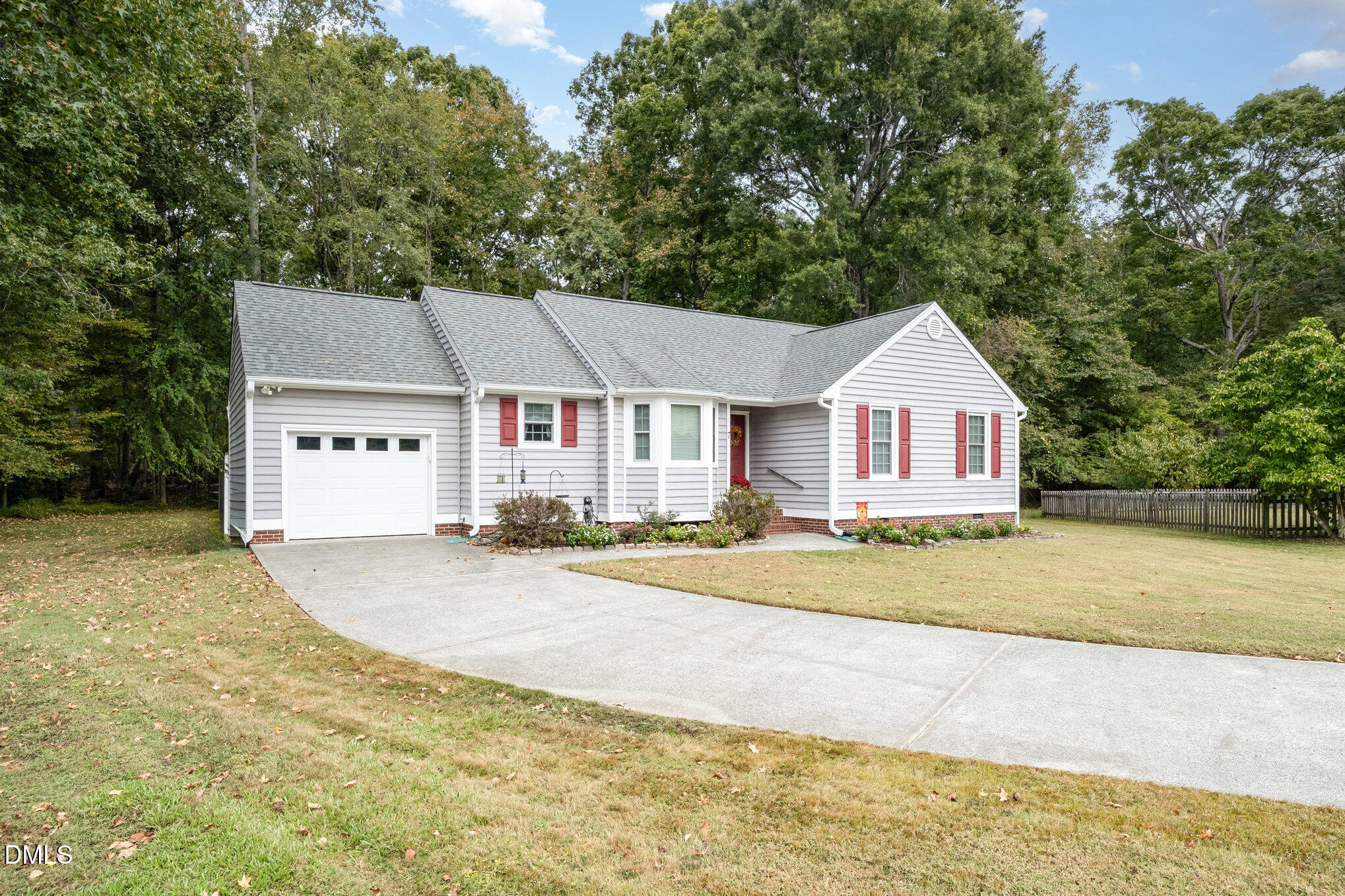 7 Neptune Court Durham, NC 27712 - Photo 4 of 39 a view of a house with a yard and large trees