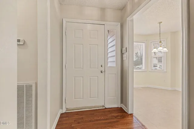 a view of a livingroom with wooden floor