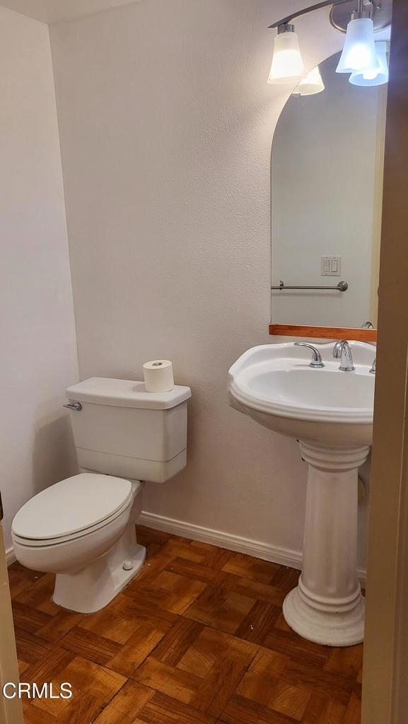 2065 East Bard Road Oxnard, CA 93033 - Photo 7 of 18 a bathroom with a sink toilet and a mirror