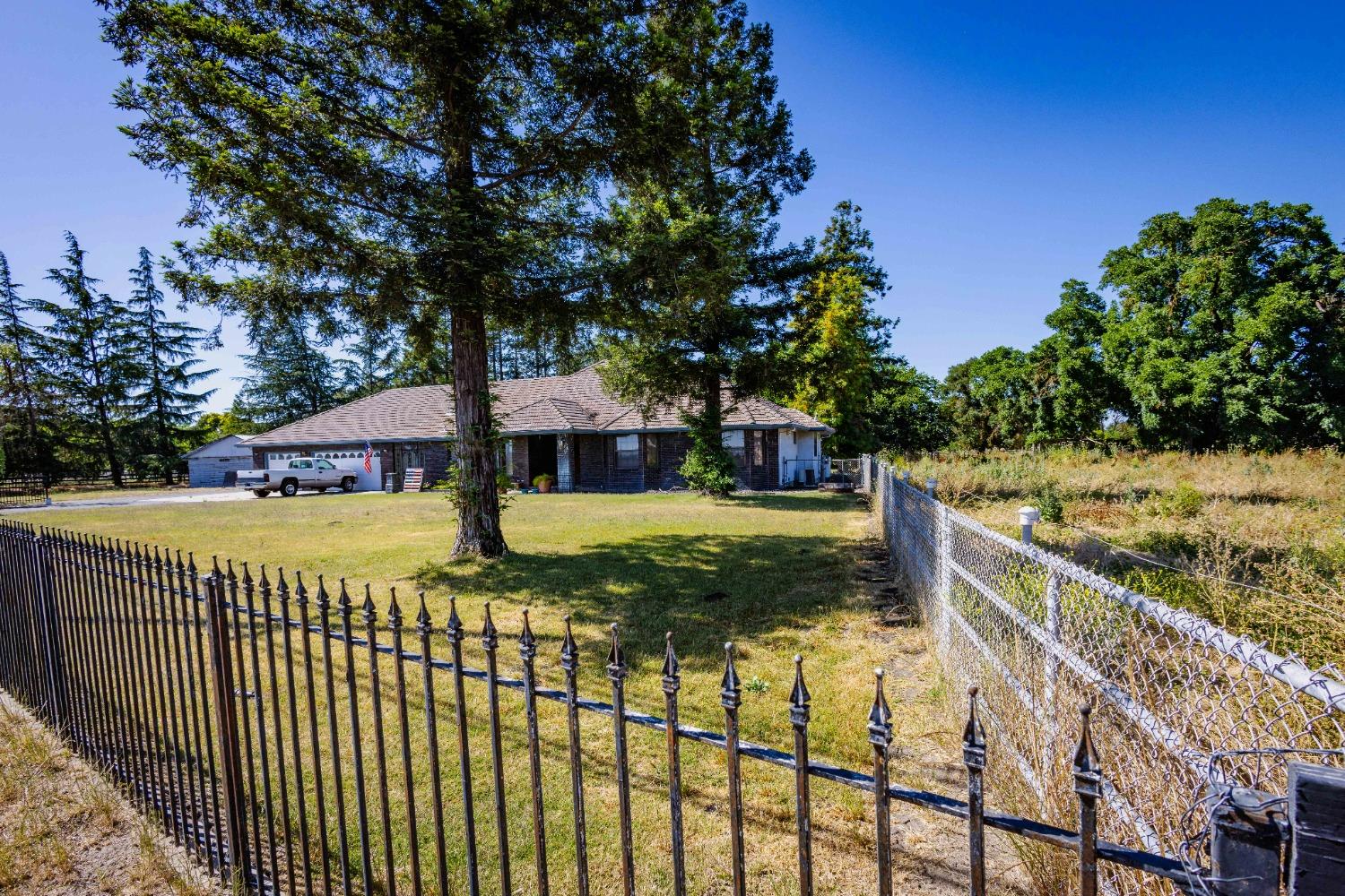 9079 Copperopolis Road Stockton, CA 95215 - Photo 1 of 1 a view of a wrought iron fences