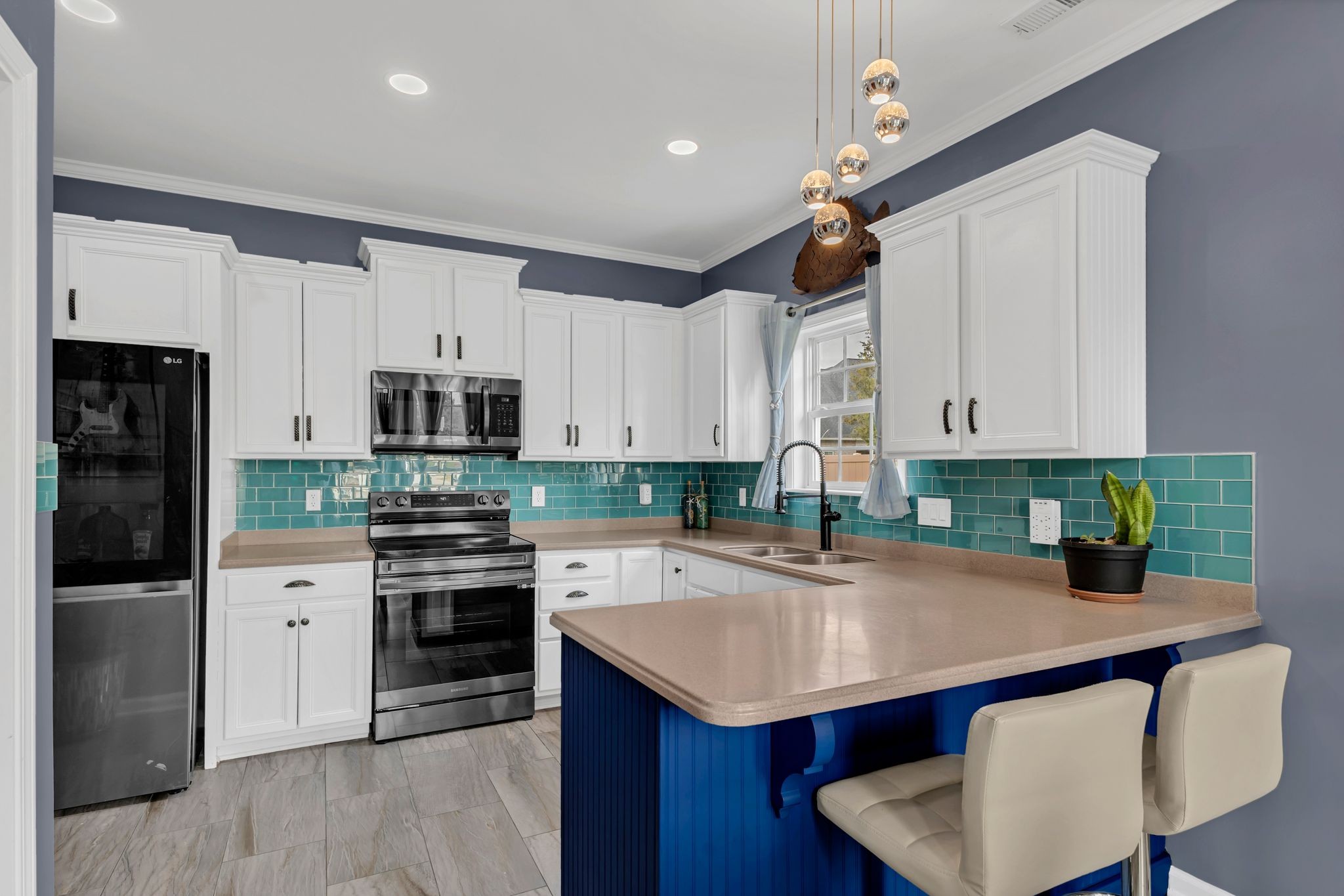1726 Splash Place Murfreesboro, TN 37130 - Photo 3 of 42 a kitchen with stainless steel appliances kitchen island granite countertop a sink a stove and refrigerator