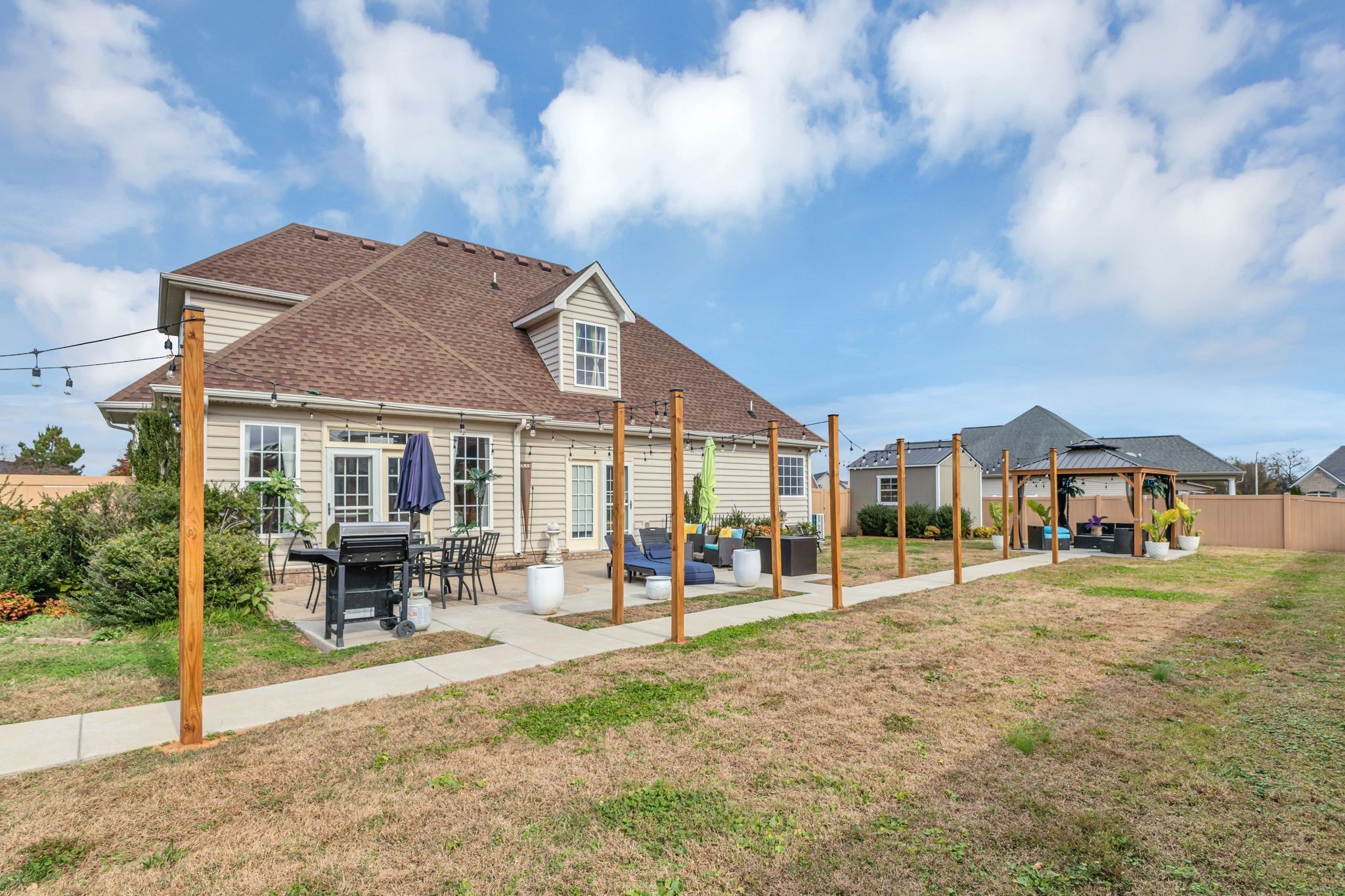 1726 Splash Place Murfreesboro, TN 37130 - Photo 38 of 42 a front view of a house with a yard table and chairs