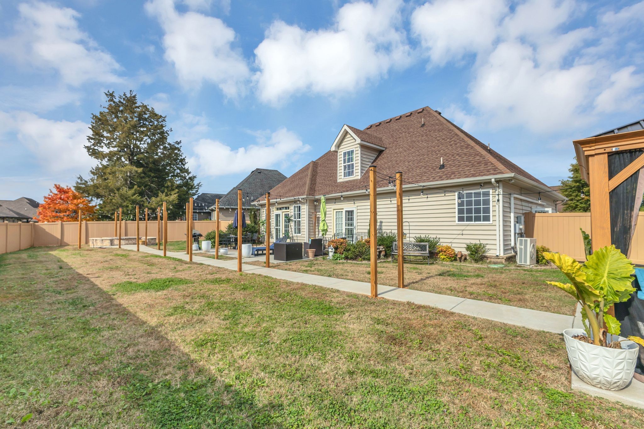 1726 Splash Place Murfreesboro, TN 37130 - Photo 40 of 42 a view of a house with a backyard and a patio