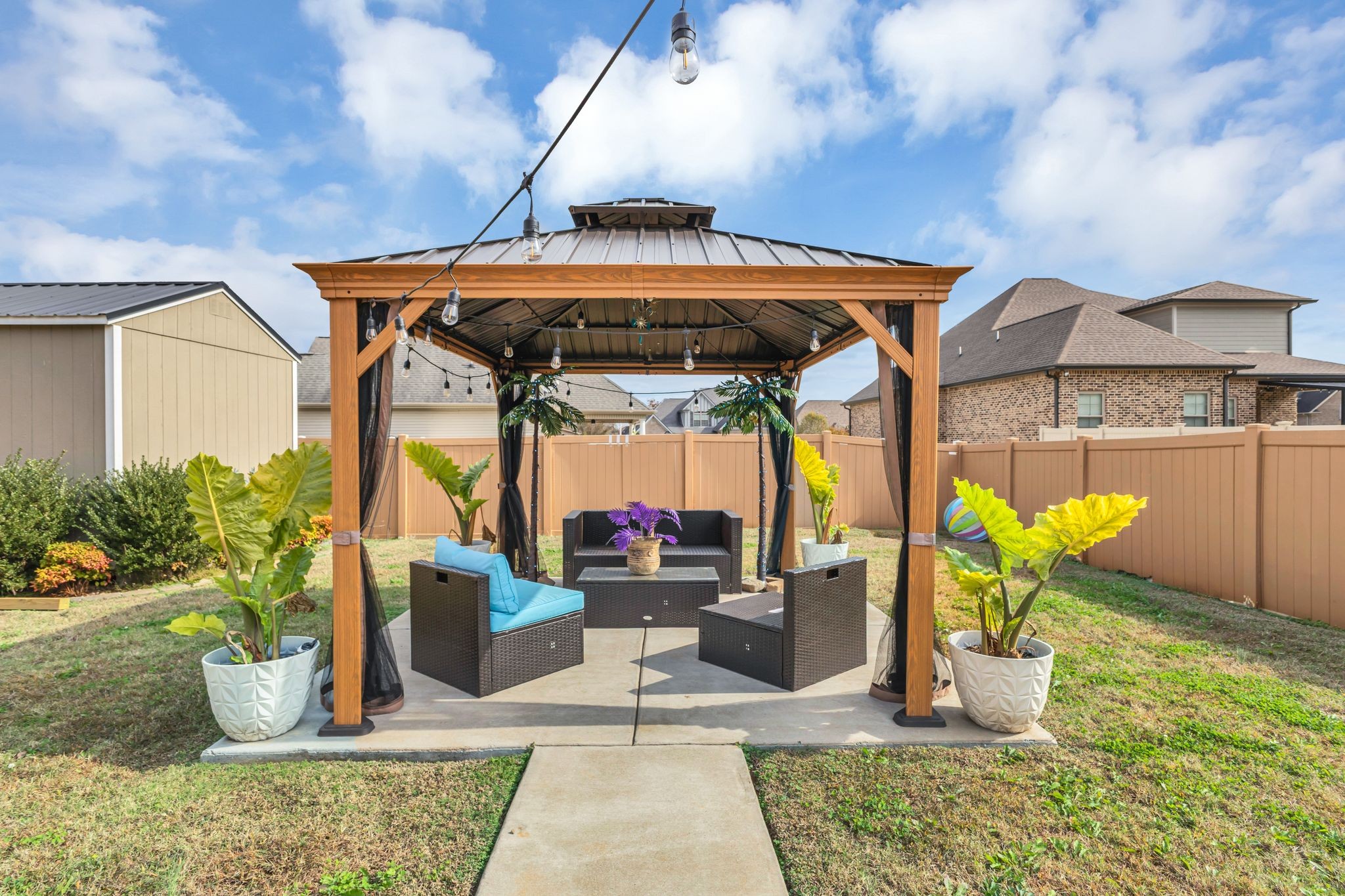 1726 Splash Place Murfreesboro, TN 37130 - Photo 41 of 42 a view of a patio with table and chairs potted plants
