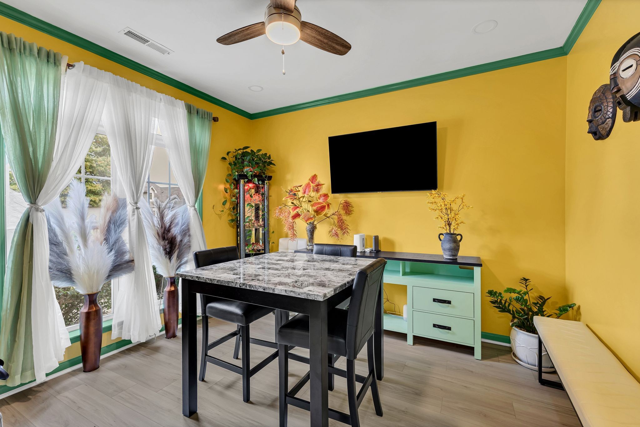 1726 Splash Place Murfreesboro, TN 37130 - Photo 6 of 42 a view of a dining room with furniture and a flat screen tv