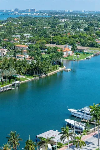 an aerial view of a houses with a lake view