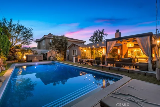 a view of swimming pool with outdoor seating