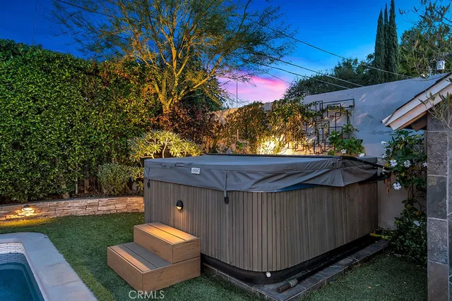 a view of a backyard with a tub