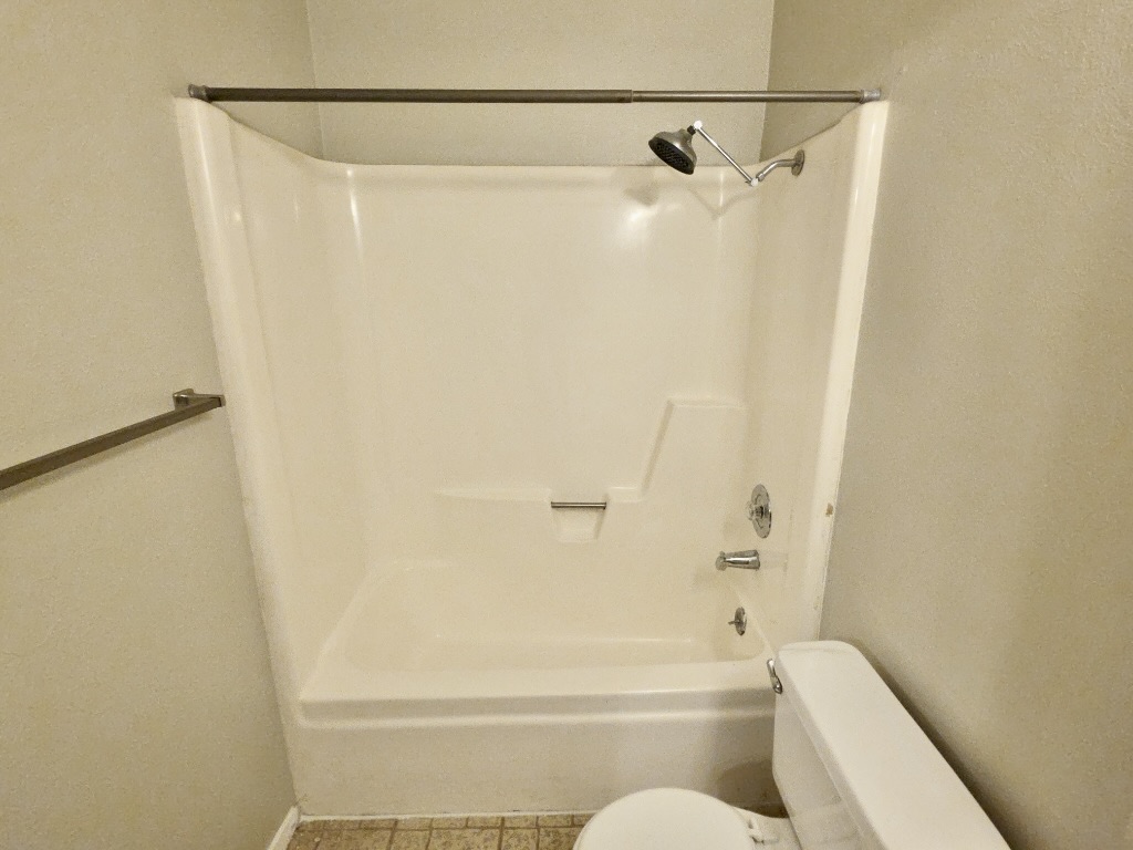 8508 Romney Road Austin, TX 78748 - Photo 12 of 21 a bathroom with a shower and a toilet