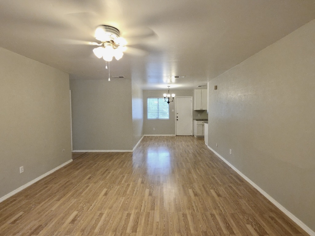 8508 Romney Road Austin, TX 78748 - Photo 3 of 21 wooden floor in an empty room with a window