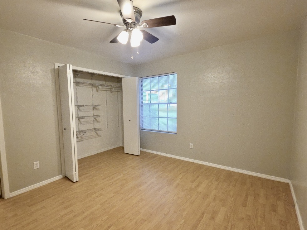 8508 Romney Road Austin, TX 78748 - Photo 9 of 21 an empty room with windows and fan