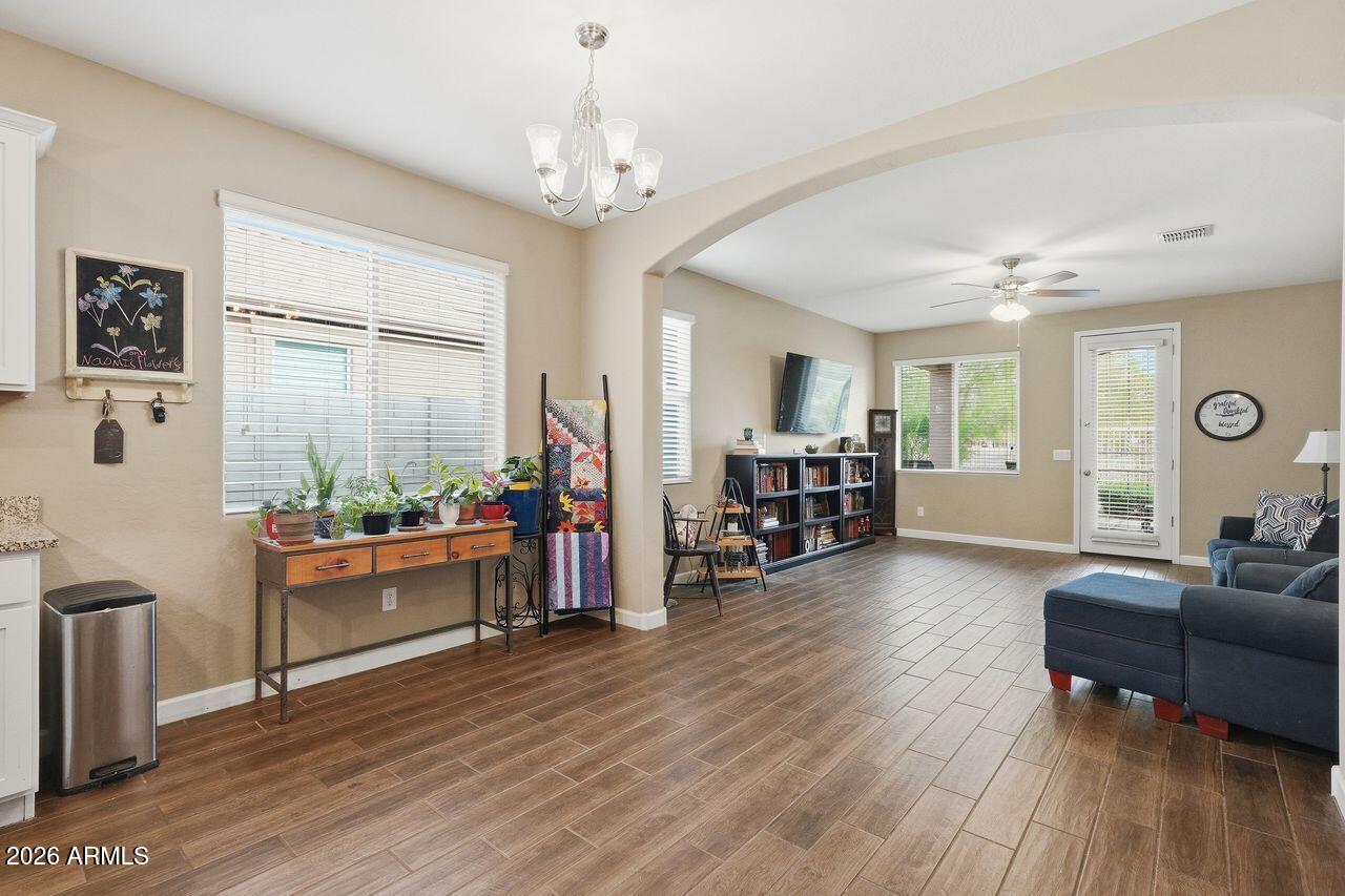 23602 West Ripple Road Buckeye, AZ 85326 - Photo 10 of 38 a living room with furniture and wooden floor