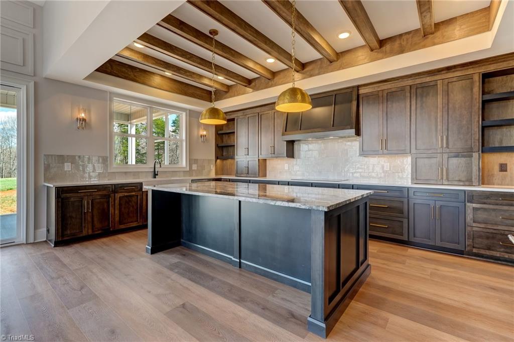 7688 Kyran Court Oak Ridge, NC 27310 - Photo 12 of 36 So many cabinets in this beautiful kitchen!