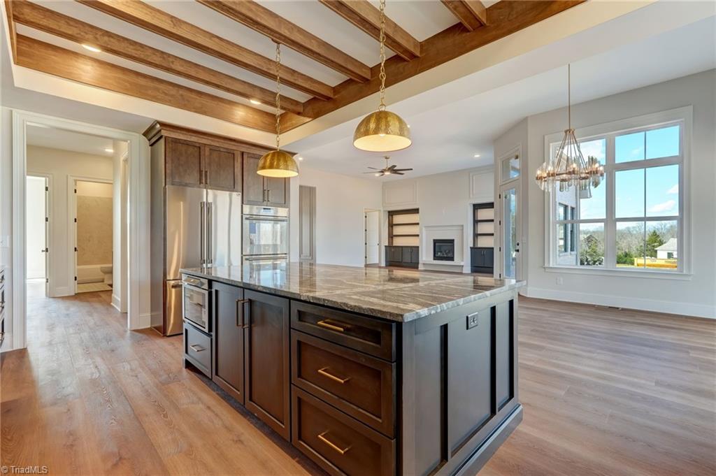 7688 Kyran Court Oak Ridge, NC 27310 - Photo 14 of 36 Corner of the kitchen looking into the great room