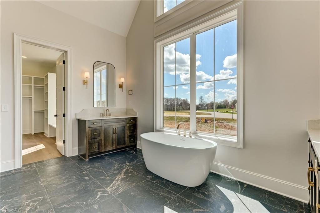 7688 Kyran Court Oak Ridge, NC 27310 - Photo 19 of 36 Natural light galore in this spa like bathroom retreat