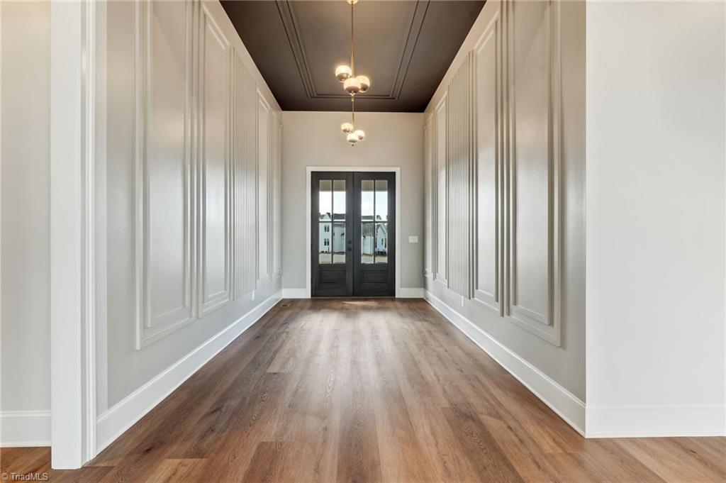 7688 Kyran Court Oak Ridge, NC 27310 - Photo 2 of 36 Grand foyer with 12 ft ceilings and architectural wall molding.